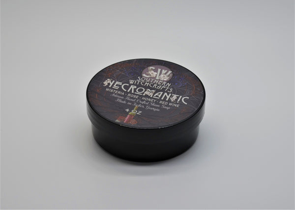 Necromantic is a bold and unique fragrance which evokes imagery of love, romance, and death, perfect for a crisp Autumn shave in a graveyard. Scent notes: Rose, wisteria, honey, red wine, dirt, ozone Ingredients: Water, stearic acid, shea butter, castor oil, potassium hydroxide, glycerine, coconut oil, sodium lactate, sodium hydroxide, jojoba oil, aloe powder, liquid aloe, isopropyl myristate, kaolin clay, fragrance Net Weight 115g.