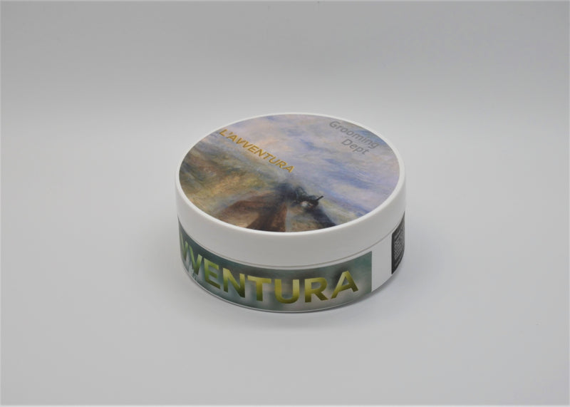L'Avventura is a Kairos tallow soap formula. Scent: L'Avventura -  IT'S A FOUGÈRE! Scent notes: Lime, Grapefruit, High Elevation Lavender, Galbanum, Saffron, Resin Accord, Texas Cedarwood, Oakmoss, Birch Tar, and Patchouli. Size: 4oz of soap in a plastic tub. The tub is oversized to allow for easy loading of your shaving brush. Ingredients: Water, Stearic Acid, Beef Tallow, Sodium Lauroyl Lactylate, Kokum Butter, Castor Oil, Tucuma Butter, Avocado Oil, Glycerin, Coconut Milk, Goat Milk, Cupuacu Butter, Shea